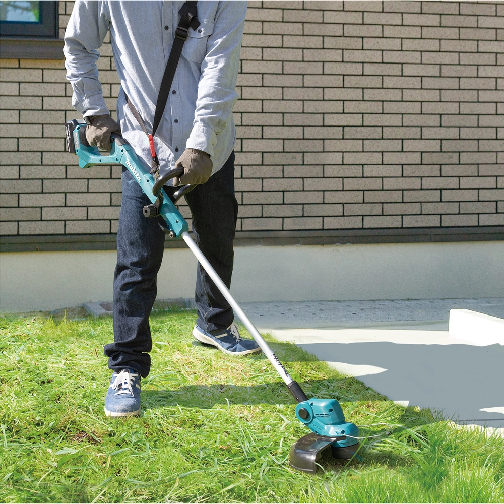 Makita akumuliatorinio trimerio ergonomiškas rankenos dizainas